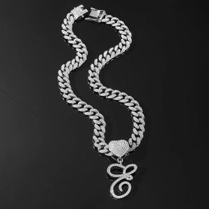 Silver iced out Cuban link necklace with heart and letter E pendant for men