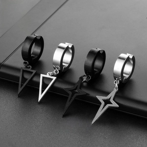 Detail of titanium steel hoop earrings set featuring triangle and star charms in silver and black