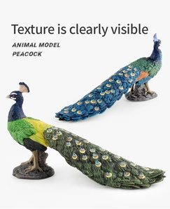 Detailed close-up of peacock models showing intricate feather textures and rock base