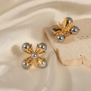 French vintage cross stud earrings with grey pearls and 18k gold plating on white silk
