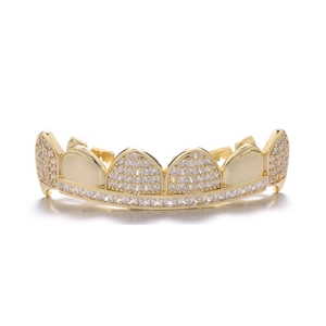 Detail of hip hop grillz featuring gold plating and iced-out white zircon stones