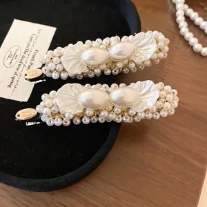 Elegant French handmade pearl hair clips with rectangle design and golden 'Hand made' tag