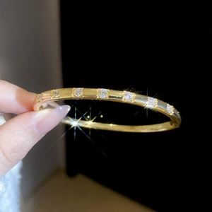 French style double-layer gold bangle with sparkling white crystals and polished finish