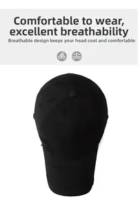 Detail view of washed black vintage baseball cap featuring distressed torn holes and 6 panels