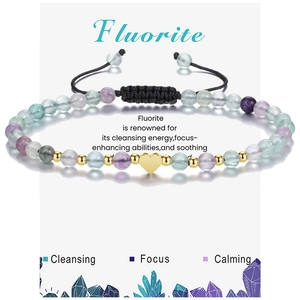 Detail of multi-color fluorite beaded bracelet with gold heart charm and adjustable cord