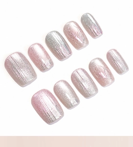 Detail of pink aurora cat eye press-on nails with 10-piece shimmering gradient finish