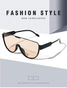 Detailed close-up of fashion shield sunglasses with brown lenses and sleek black frame