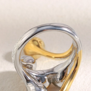 Detail view of bold two-tone 18K gold plated stainless steel ring with mirror finish