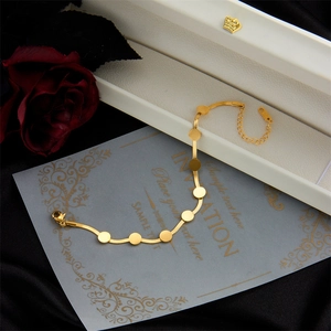 Minimalist gold snake chain bracelet with polished round sequins and adjustable clasp