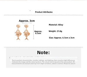 Detail view of gold fish earrings with size 6.5x3cm and weight 21.8g specifications