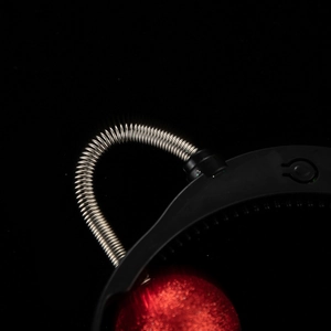 Macro shot of Halloween alien headband with silver spring and red glitter eyeball detail