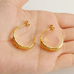 Golden 18k stainless steel C-shaped hoop earrings with hammered texture for women