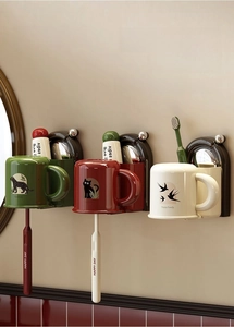 Detail showing wall-mounted suction cup toothbrush holders with upside-down cups