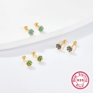 Macro detail of 925 sterling silver flower earrings with colorful zircon and screw backs