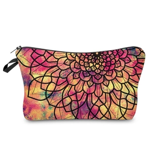 Macro detail of mandala pattern makeup bag with black zipper and portable handle strap