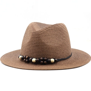 Brown woven panama hat with nautical wood bead trim and breathable straw texture