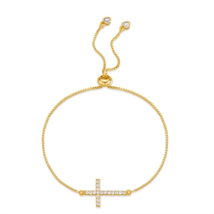 Detail of adjustable gold box chain bracelet with a sparkling zircon inlaid cross pendant
