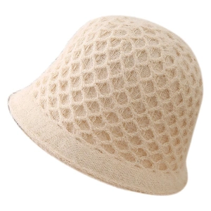 Chic cream white hand-crocheted bucket hat with hollow honeycomb knit texture for women