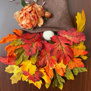 Autumn gnome door hanging with brown burlap hat and vibrant faux fall maple leaf beard