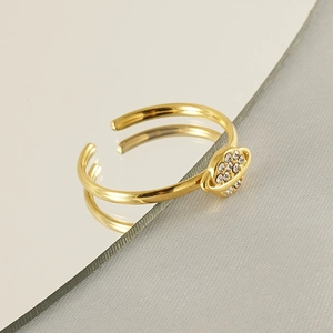 Macro shot of 18k gold plated planet ring featuring crystal rhinestones and mirror reflection