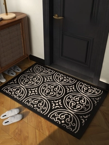 Detail of polypropylene entryway rug with abstract geometric patterns and non-slip texture