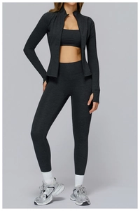 Close-up of charcoal gray yoga set with thumb hole sleeves and high waist texture