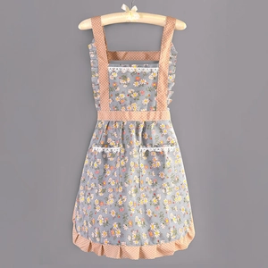 Floral print kitchen apron with lace details and polka dot ruffles on grey background