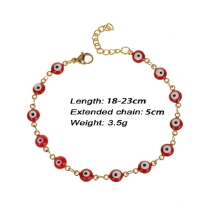Adjustable golden stainless steel bracelet featuring a vibrant red evil eye charm detail