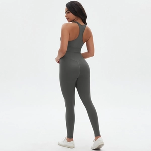 Detail of dark grey seamless racerback sports bra and high-waisted yoga pants set