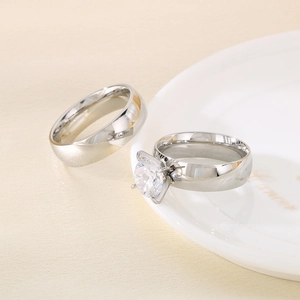 Polished stainless steel couple rings set featuring a classic band and a zircon wedding ring