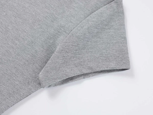 Detailed close-up of grey modal t-shirt sleeve cuff with reinforced fine stitching
