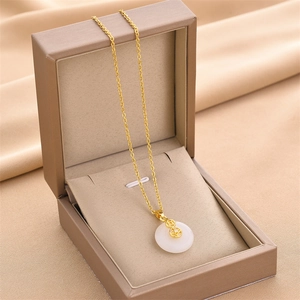 Gold-plated titanium steel necklace with white jade pendant and sparkling gourd charm