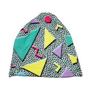 Detail of 90s Memphis style geometric print on soft knitted beanie for autumn