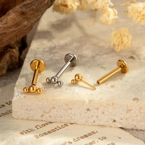 G23 titanium labret studs in gold and silver finish with triple bead cluster design
