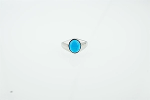 Detail showing vintage silver titanium steel ring with an oval turquoise stone setting