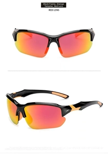 Detail view of sport sunglasses with black frame, orange temples, and red mercury lenses