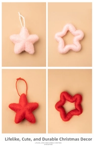 Macro detail of handmade red and pink felt Christmas star ornaments with hanging ropes