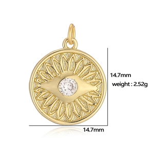 Detailed view of round gold pendant with sunburst motif and clear zircon 14.7mm