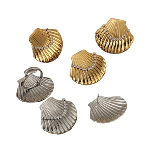 Golden and silver fan-shaped earring and ring set with sparkling zircon inlays