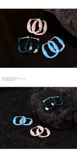 Close-up detail of S925 silver U-shaped earrings with colorful enamel craft finish