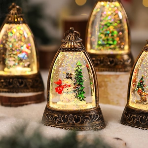 Close-up of vintage bronze Christmas lantern with snow globe effect and warm LED lights