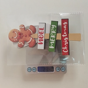 Weight measurement of wooden Merry Christmas and Noel party signs on digital scale