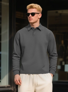 Close-up of charcoal grey long sleeve polo shirt showing premium herringbone knit texture
