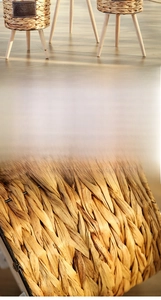 Detail of hand-woven wicker flower pot with three wooden legs and Natural Home label