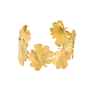 Detailed view of golden leaf-shaped stainless steel bracelet with textured veins