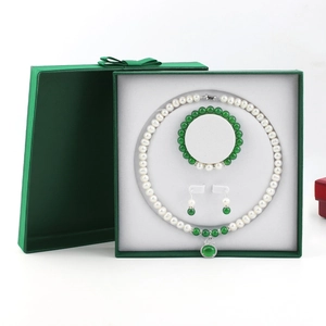 Elegant jewelry gift set with pearl necklace and green gourd pendant in a box