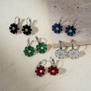 Macro detail of five-color flower earring set with high-saturation petals and silver hooks