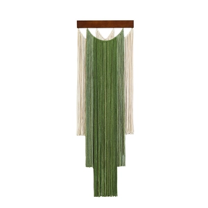 Bohemian macrame wall hanging with gradient green tassels and dark wooden rod