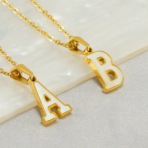 Golden stainless steel necklaces featuring letter A and B pendants with white shell inlay