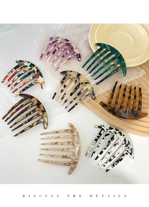 Detailed view of assorted acetate hair side combs in colorful marble and tortoise patterns